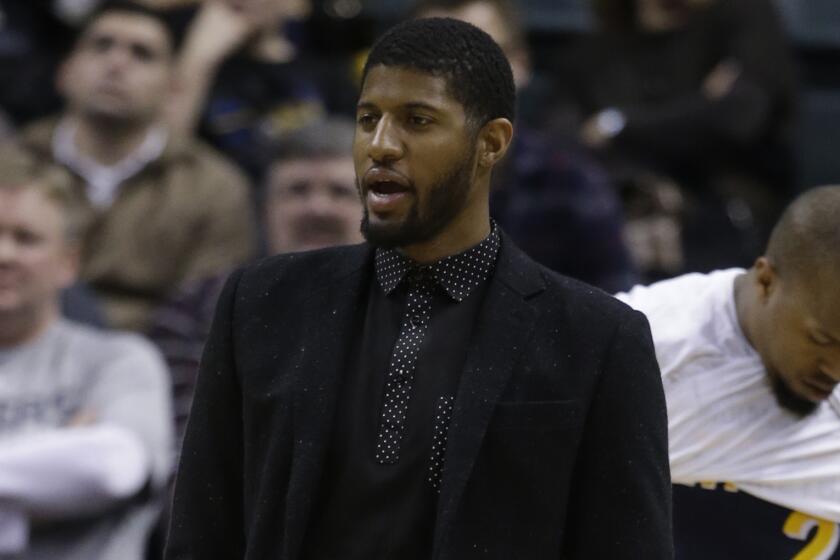 Indiana Pacers forward Paul George watches from the sideline during a game against the Detroit Pistons on Wednesday.