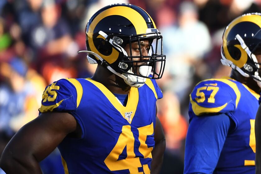 LOS ANGELES, CA - AUGUST 24: Linebacker Obo Okoronkwo #45, defensive end John Franklin-Myers #94 and defensive tackle Tanzel Smart #92 of the Los Angeles Rams during a pre season football game against Denver Broncos at Los Angeles Memorial Coliseum on August 24, 2019 in Los Angeles, California. (Photo by Kevork Djansezian/Getty Images)