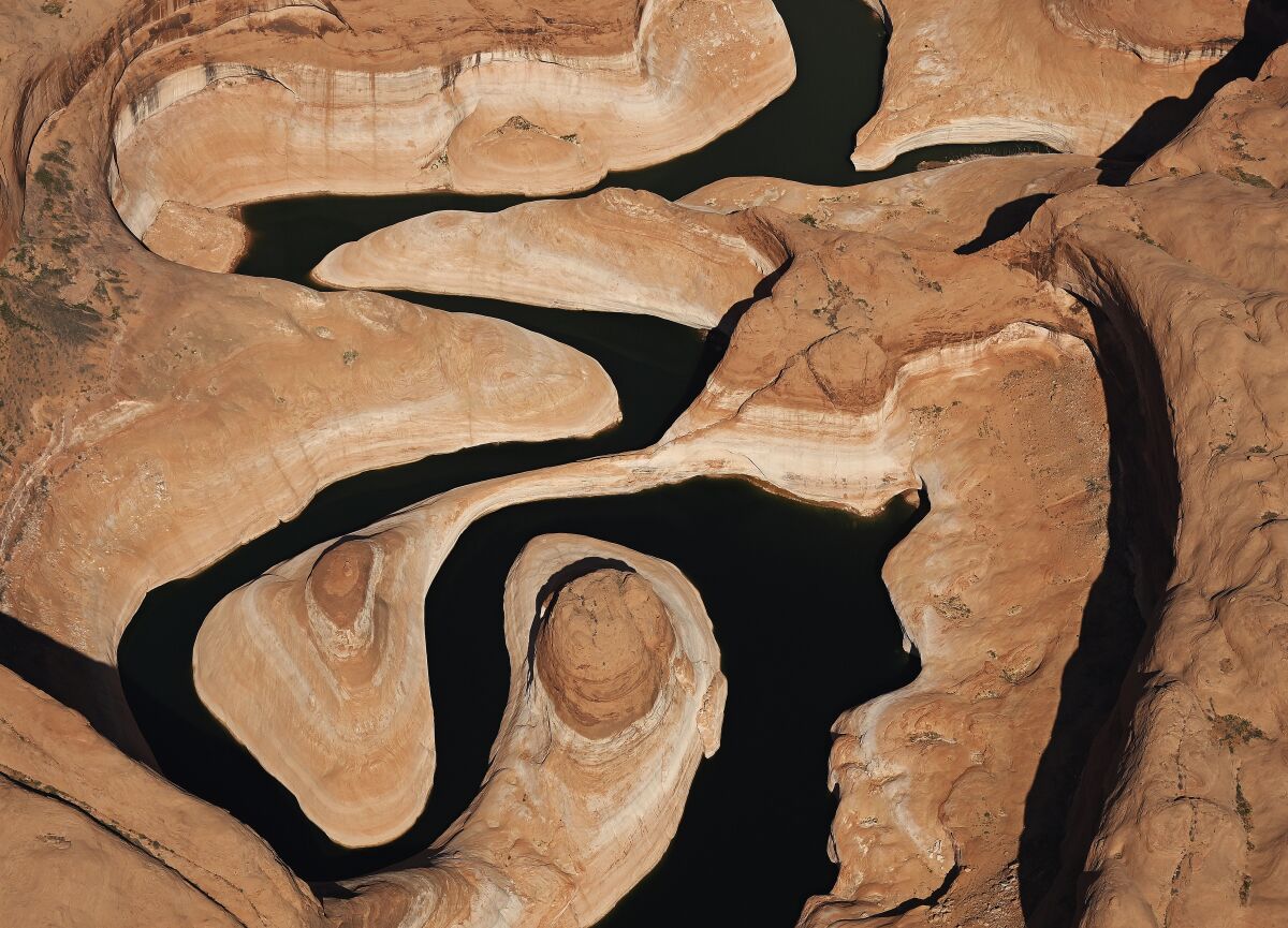 LAKE POWELL, UTAH - APRIL 15: A bathtub ring seen above the waterline around Lake Powell was created during drought that reduced the flow of the Colorado River on April 15, 2023 in Lake Powell, Utah. The flight for aerial photography was provided by LightHawk. (Photo by RJ Sangosti/MediaNews Group/The Denver Post via Getty Images)