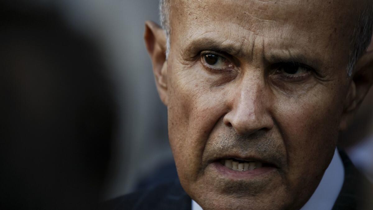 Former Los Angeles County Sheriff Lee Baca talks to reporters outside the federal courthouse after his first trial ended in mistrial in 2016.