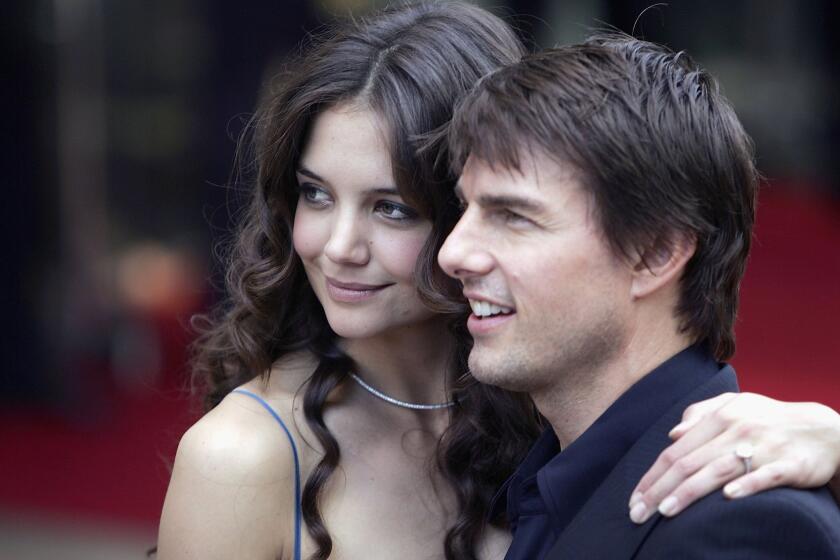 Katie Holmes and Tom Cruise arrive at the "War Of The Worlds" premiere.