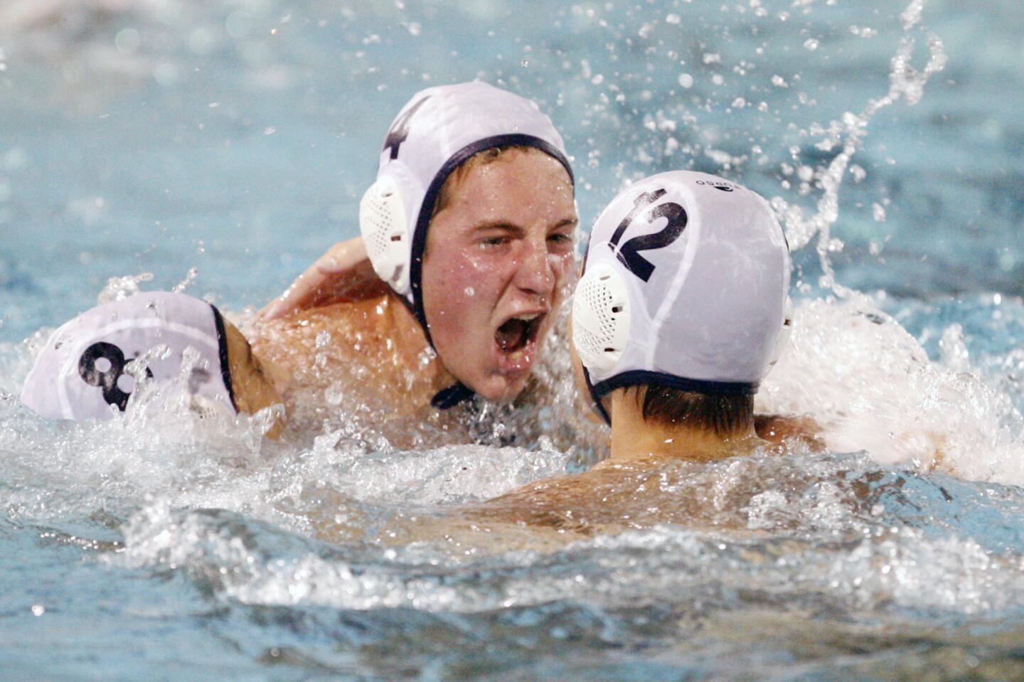 Pasadena Poly's Ryan Schiller, center, rejoices with his teammates after winning the CIF Southern Section Division V championship match against Glendale, which took place at William Woollett Jr. Aquatic Center in Irvine on Saturday, November 17, 2012.
