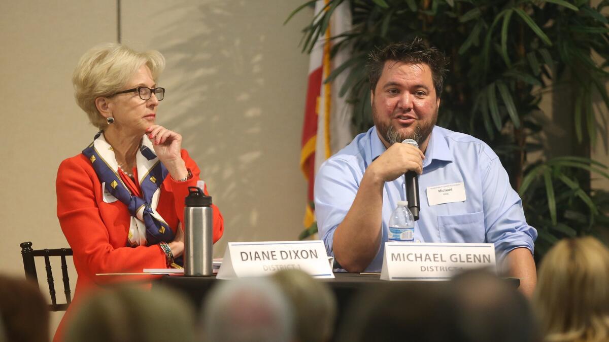 Mike Glenn, a candidate for the District 1 seat on the Newport Beach City Council, speaks during a candidate forum Thursday as incumbent Diane Dixon listens.