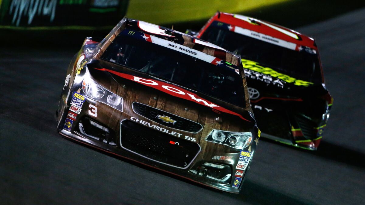 NASCAR driver Austin Dillon leads Erik Jones into a turn during the Coca-Cola 600 on Sunday night at Charlotte Motor Speedway.