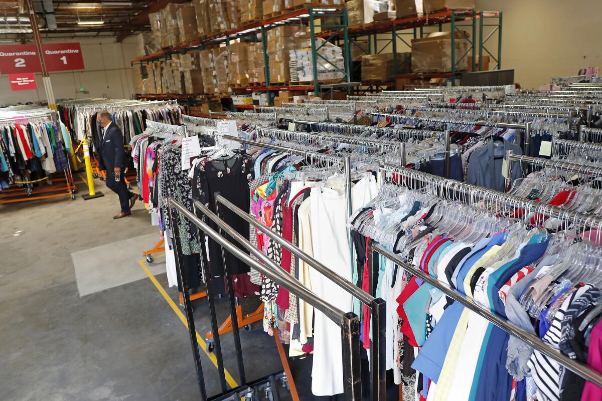 Donated professional clothing stocks the recently opened donation center of Working Wardrobes in Irvine.