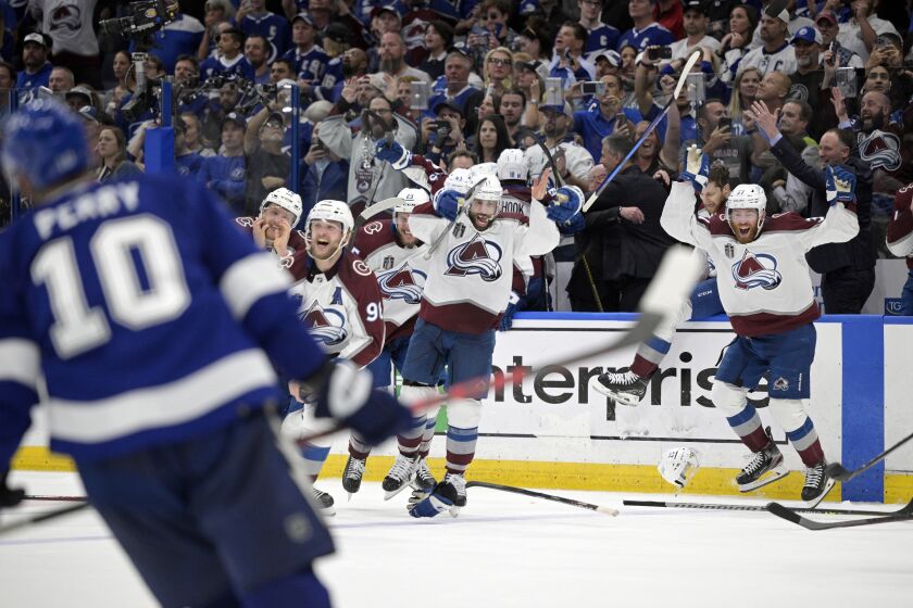 FILE - The Colorado Avalanche celebrate winning the Stanley Cup against the Tampa Bay Lightning in Game 6 of the NHL hockey Stanley Cup Finals on Sunday, June 26, 2022, in Tampa, Fla. Thanks to an unprecedented level of skill and speed on the ice, business is booming going into what's expected to be the league's first full season on a normal schedule since before the pandemic. (AP Photo/Phelan Ebenhack, Fiule)