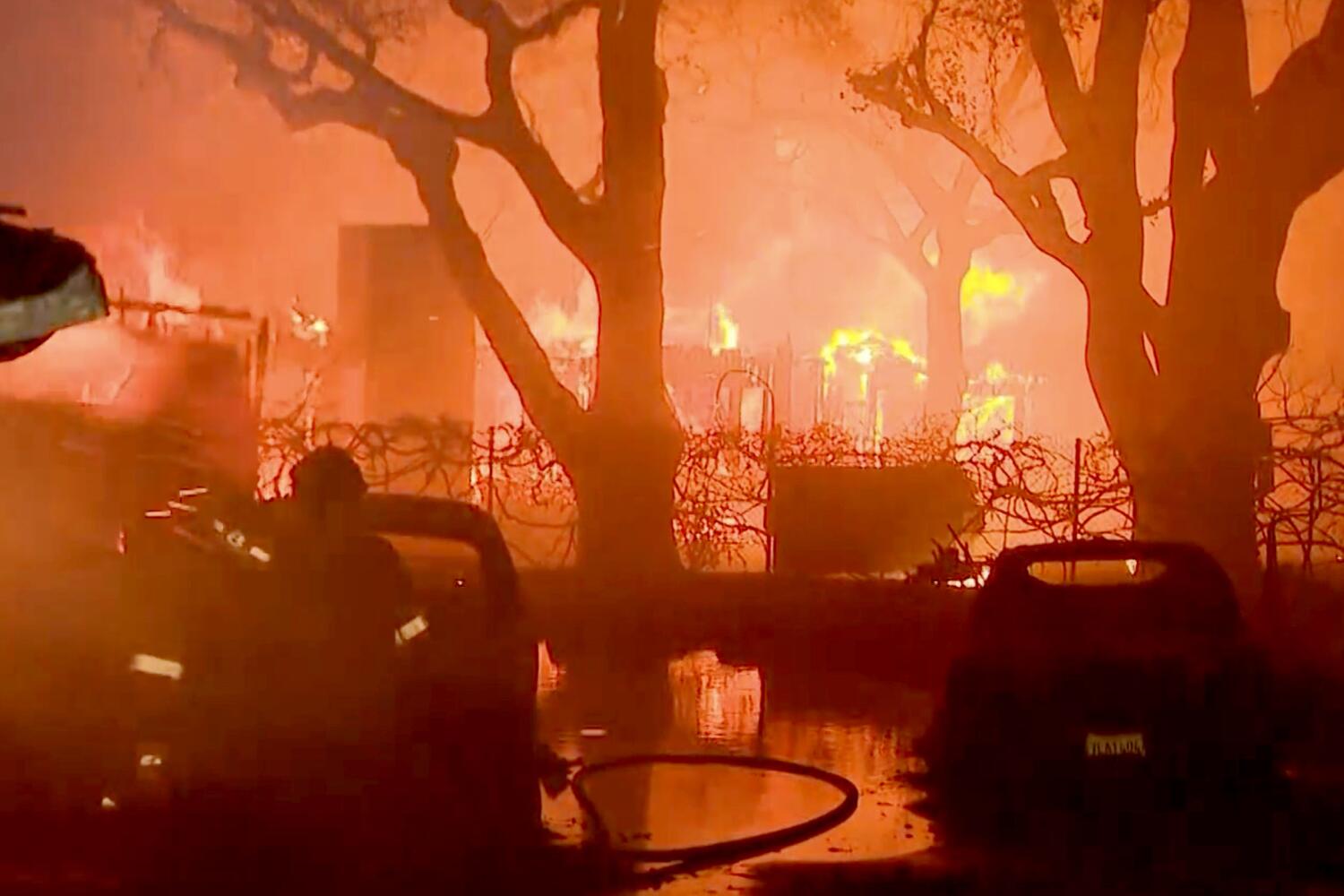 Homes burn near Altadena Dr. and New York Dr. in Altadena due to the Eton Fire on Tuesday night, Jan. 7, 2025.