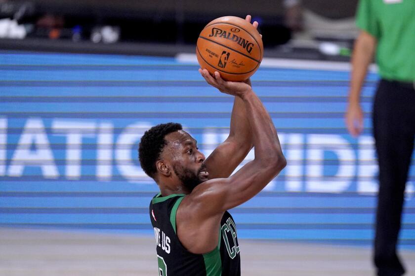 The Celtics' Kemba Walker shoots against the Raptors on Sept. 11, 2020.