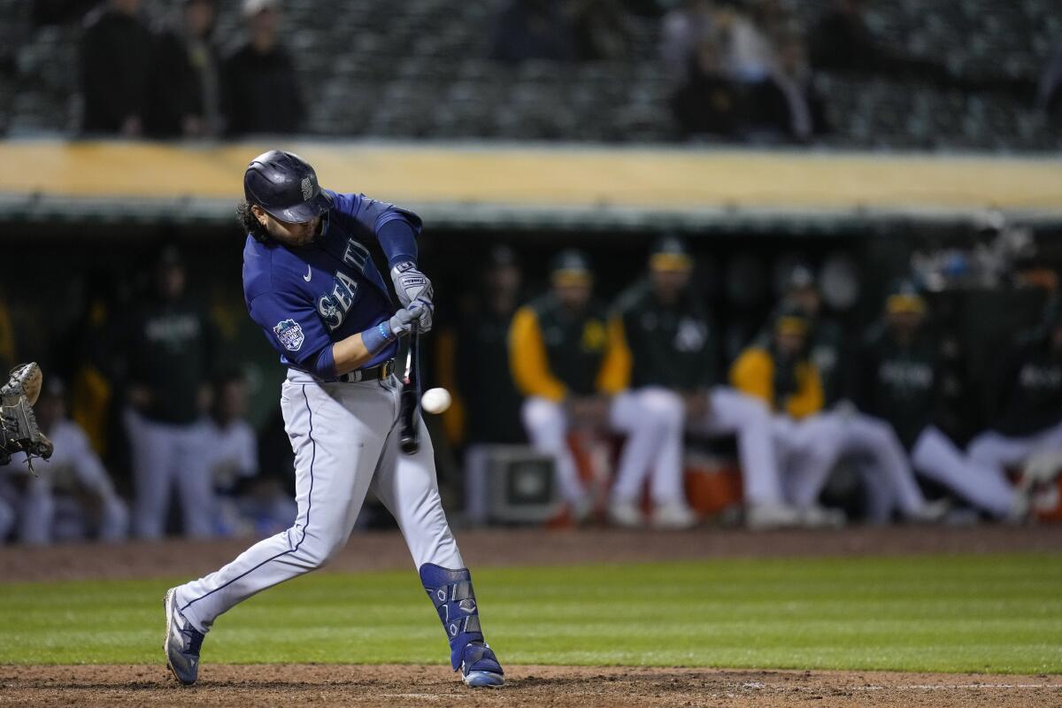 Pollock, Suárez homer late, Mariners beat A's 7-2 in 10 - The San Diego  Union-Tribune