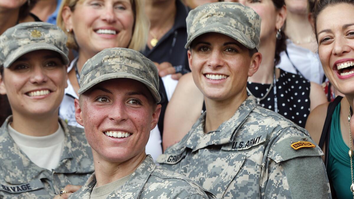 Army 1st Lt. Shaye Haver, second from left, and Capt. Kristen Griest, right, celebrate with other West Point alumnae after graduating from Ranger School on Aug. 21, 2015.