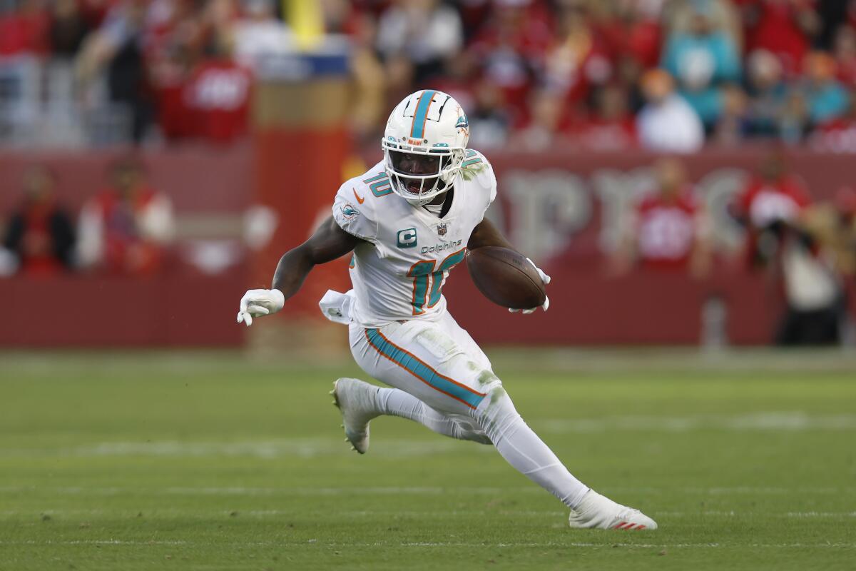 Miami Dolphins wide receiver Tyreek Hill runs with the ball against the San Francisco 49ers on Dec. 4.