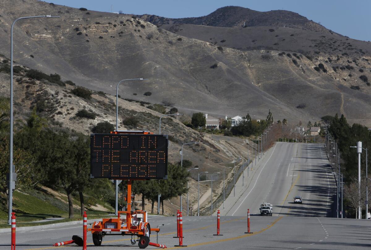A sign in Porter Ranch alerts residents to call 911 to report crime in the area. More than 2,000 people have been placed in temporary housing because of a gas leak at the nearby Aliso Canyon storage facility.