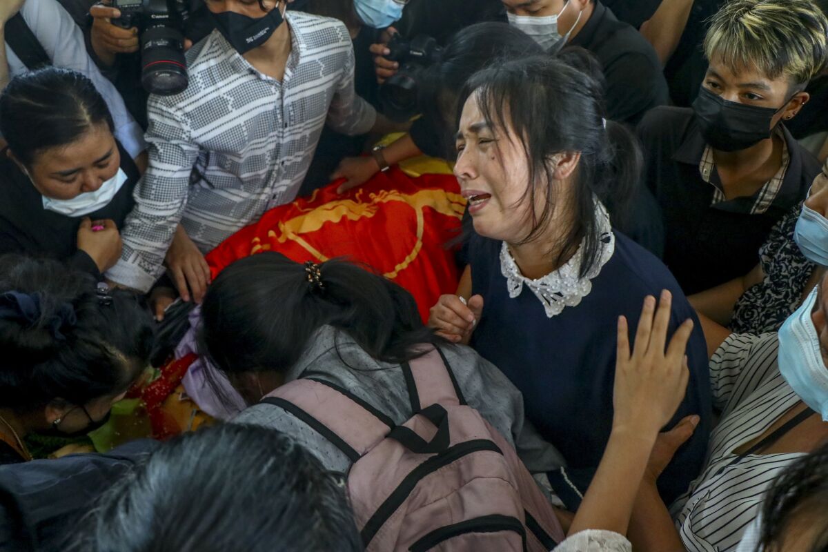 FILE - The mother of Khant Ngar Hein, killed during anti-government protests, mourns during his funeral in Yangon, Myanmar Tuesday, March 16, 2021. As Feb. 1, 2023, marks two years after Myanmar’s generals ousted Aung San Suu Kyi’s elected government, thousands of people have died in civil conflict and many more have been forced from their homes in a dire humanitarian crisis. (AP Photo, File)