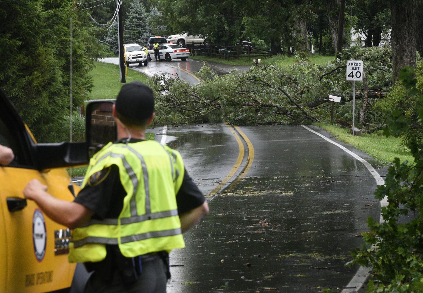 A downed tree blocks Deer Park Road at the intersection of Gracie Drive in Finksburg after a powerful storm blew through the area Monday, JUly 22, 2019.
