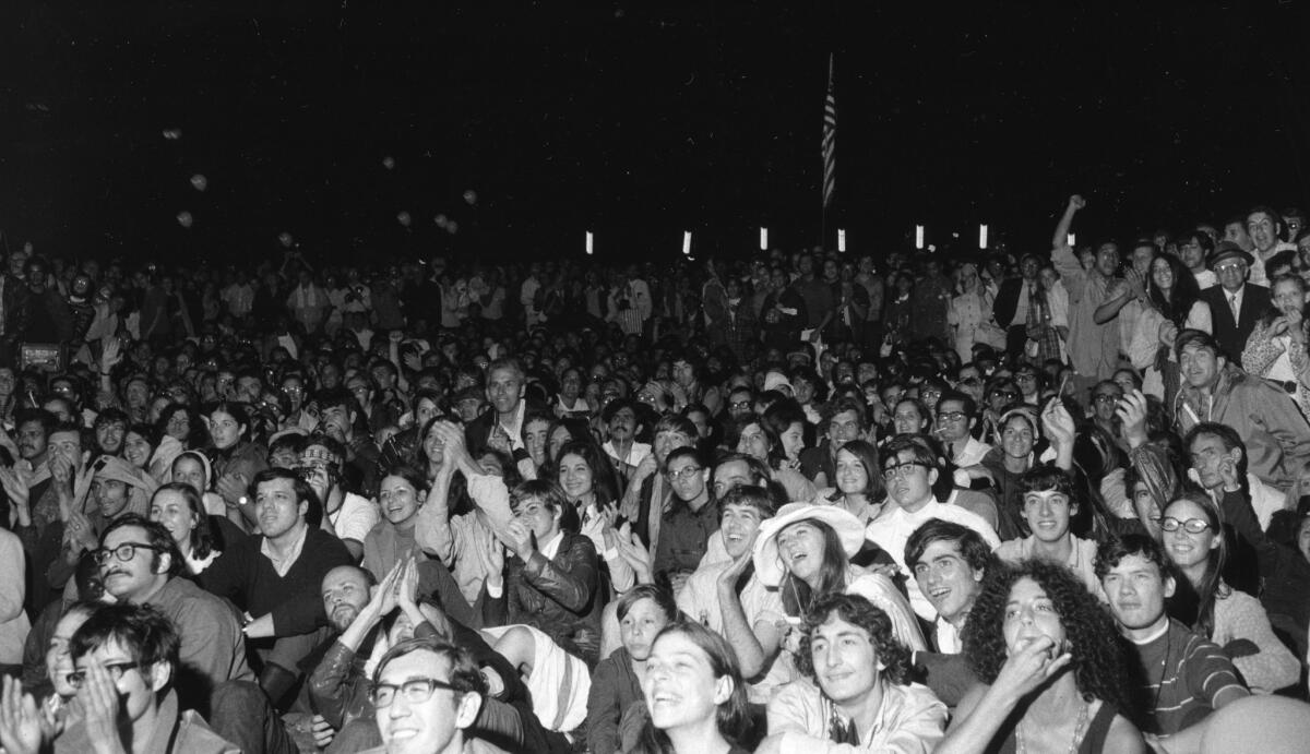 An estimated 10,000 people watched giant TV screens in New York's Central Park as Neil Armstrong stepped onto the lunar surface.