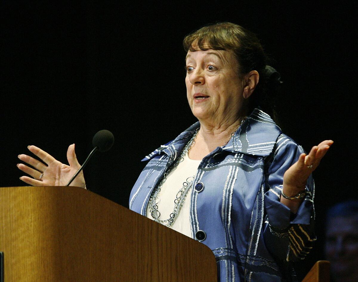 Patricia Anderson throws out her arms and says she's at a loss for words after receiving the Les Tupper Community Service Award, presented by the La Cañada Flintridge Coordinating Council at Jet Propulsion Laboratory on Monday, May 13, 2013. The 45th annual award was given to seven recipients.