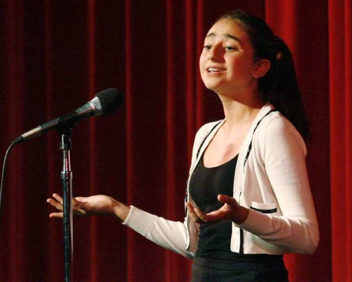 Anna Parsamyan, 13, of Woodrow Wilson Middle School, recites a poem at the 11th Annual Genocide Commemoration at Glendale High School.