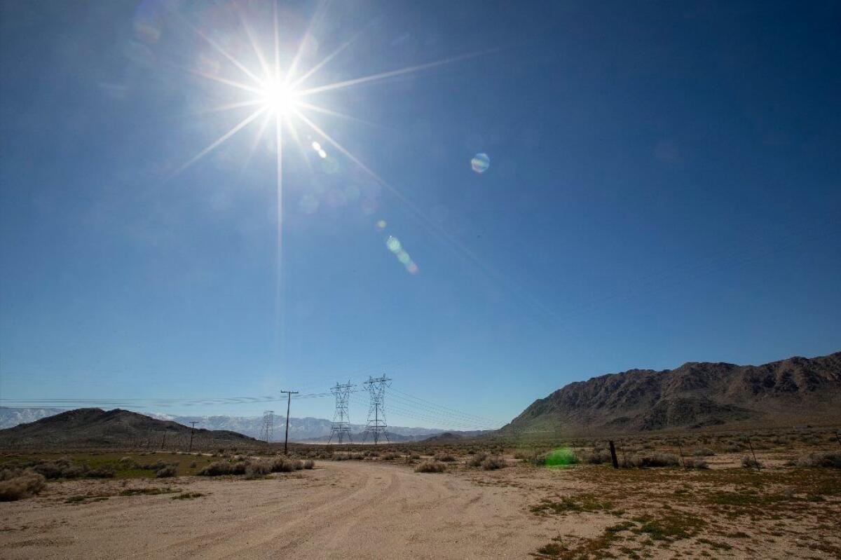Long-distance power lines run through the Lucerne Dry Lake area, where several large solar projects have been proposed, in San Bernardino County, as seen on Feb. 25, 2019.