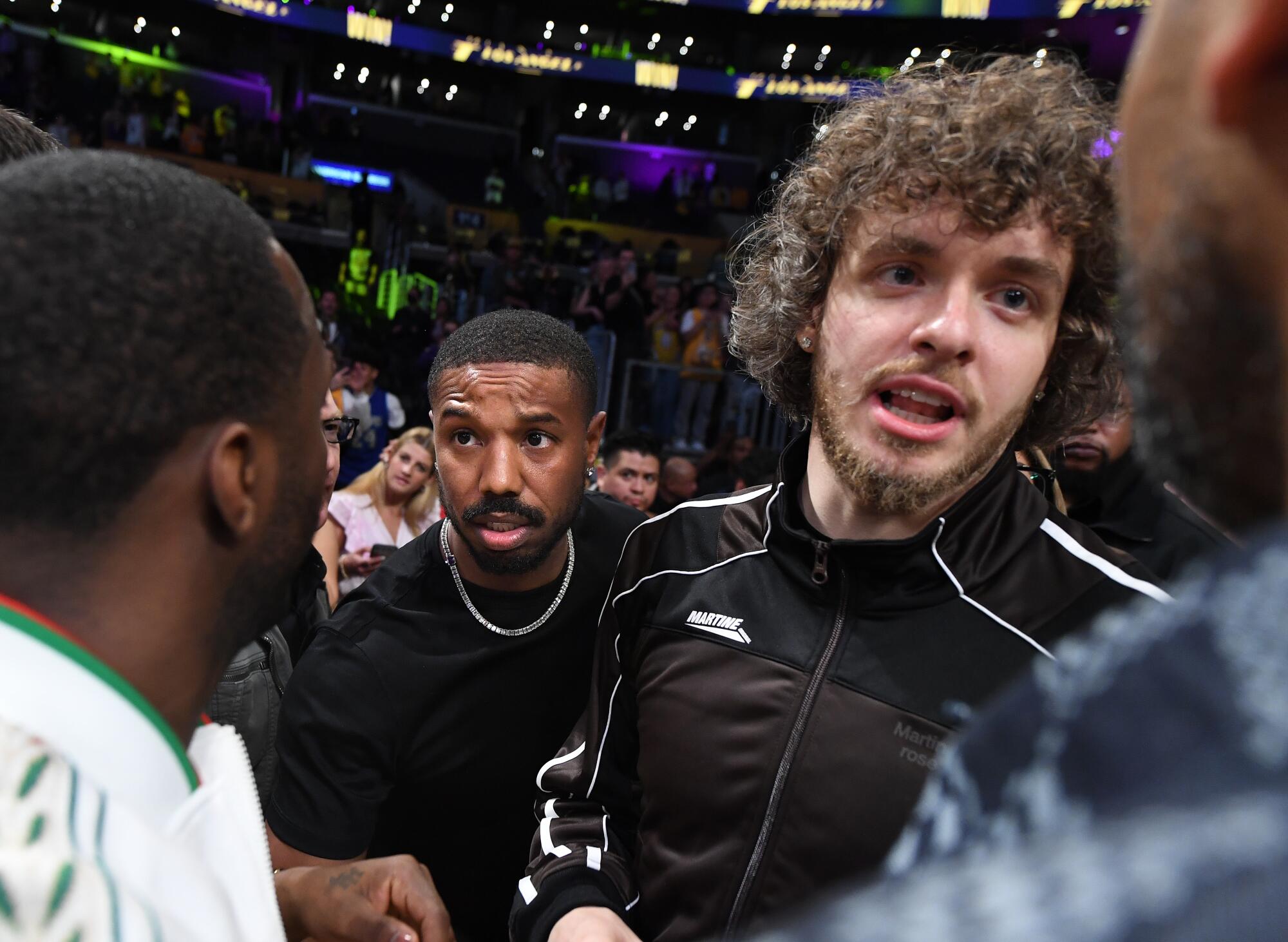 Michael B. Jordan and Jack Harlow attend a playoff game at Crypto.com Arena.
