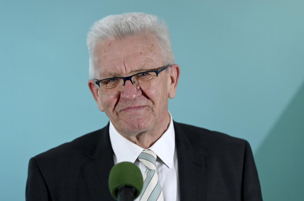 Winfried Kretschmann, Minister President of Baden-Wuerttemberg and top candidate of the Green Party, comments on the results of the state elections in Baden-Wuerttemberg in the House of Representatives in Stuttgart, Germany, Sunday, March 14, 2021. Exit polls are pointing to defeats for Chancellor Angela Merkel’s center-right party CDU in two German state elections.(Marijan Murat/dpa via AP)