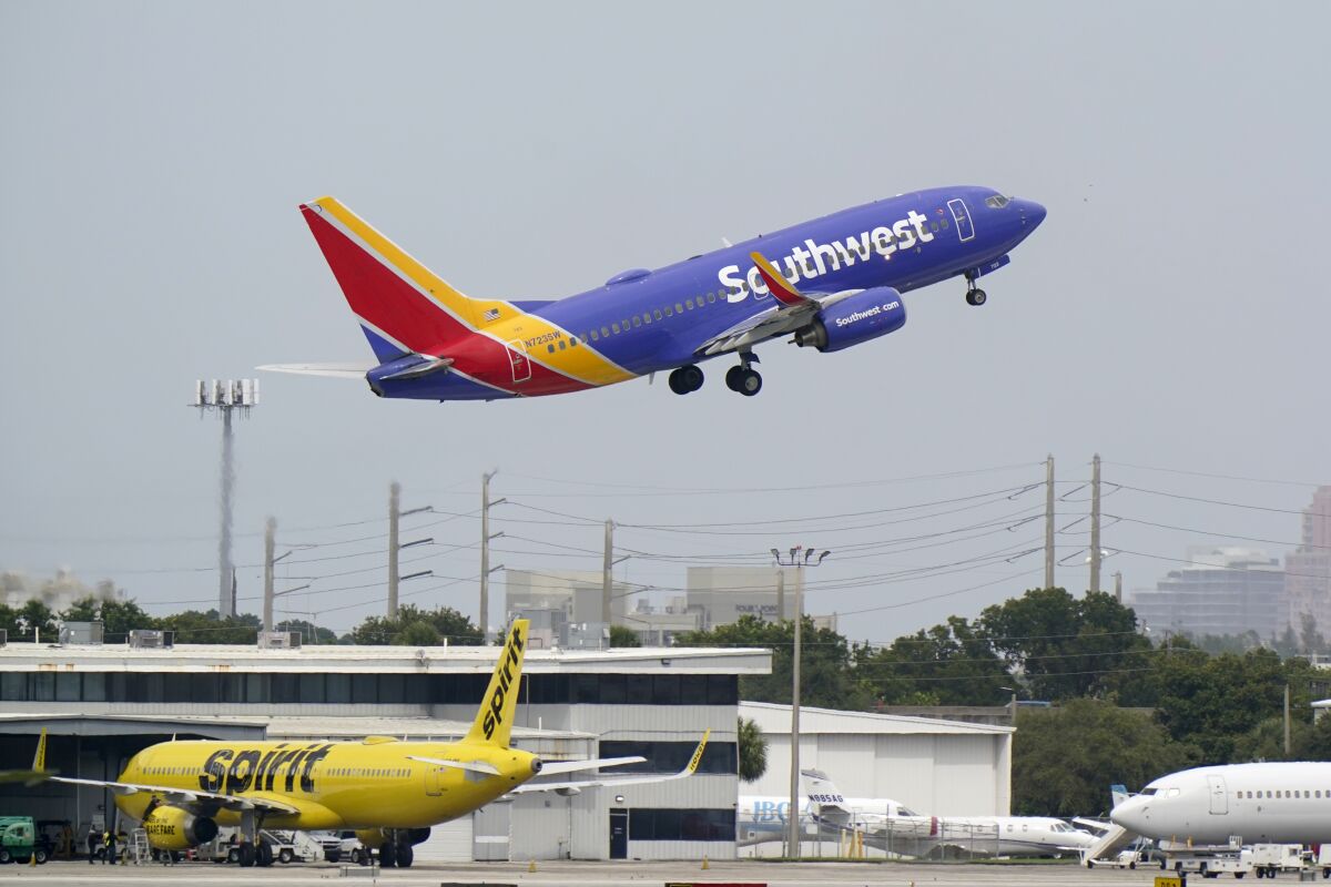 FILE - A Southwest Airlines Boeing 737-7H4 takes off, Tuesday, Oct. 20, 2020, from Fort Lauderdale-Hollywood International Airport in Fort Lauderdale, Fla. Southwest Airlines is reporting a loss of $278 million in the first quarter, Thursday, April 28, 2022, but says it will be profitable the rest of 2022. (AP Photo/Wilfredo Lee)