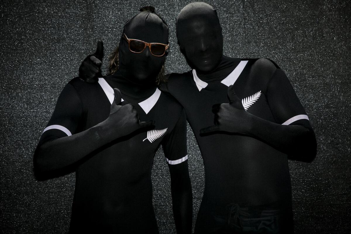 Two guys in fancy black sausage casings? It looks like art. But this image of revelers was taken at this year's Coachella Valley Music and Arts Festival.
