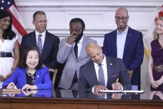 Maryland Gov. Wes Moore signs an executive order to issue more than 175,000 pardons for marijuana convictions on Monday, June 17, 2024 in Annapolis, Md. Maryland Secretary of State Susan Lee is seated left. Standing left to right are Lt. Gov. Aruna Miller, Maryland Attorney General Anthony Brown, Shiloh Jordan, Jason Ortiz, director of strategic initiatives for Last Prisoner Project and Heather Warnken, executive director of the University of Baltimore School of Law Center for Criminal Justice. (AP Phopto/Brian Witte)