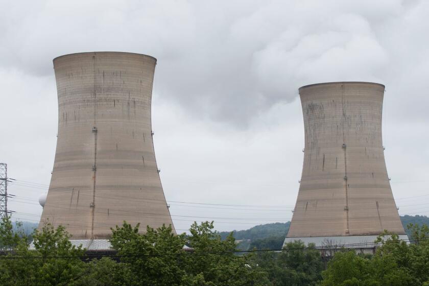Shown are a cooling towers at the Three Mile Island nuclear power plant in Middletown, Monday, May 22, 2017. (AP Photo/Matt Rourke)
