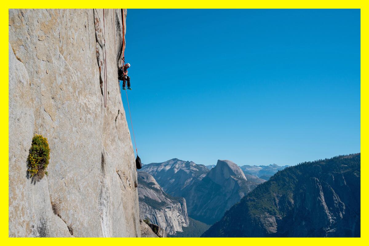 A man uses only his arms to ascend El Capitan in Yosemite Valley. 