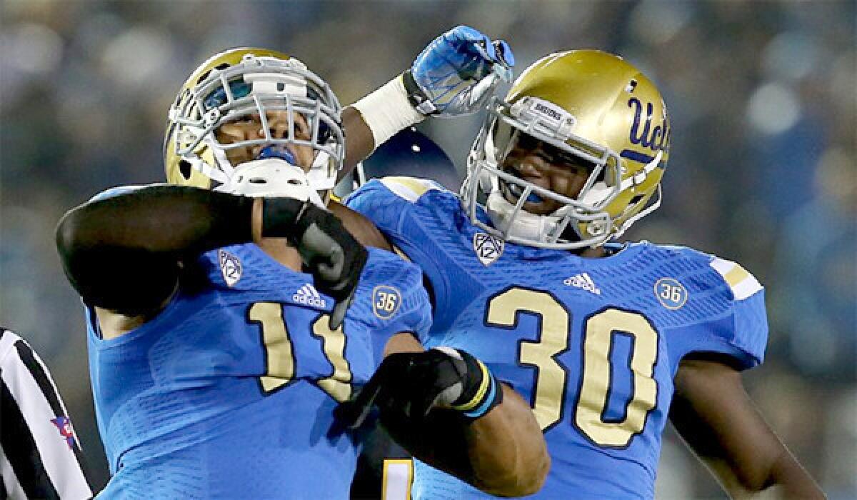 UCLA linebacker Anthony Barr, left, was named first-team All-American by the Associated Press. Barr recorded 42 tackles with 10 sacks in his senior season for the Bruins.
