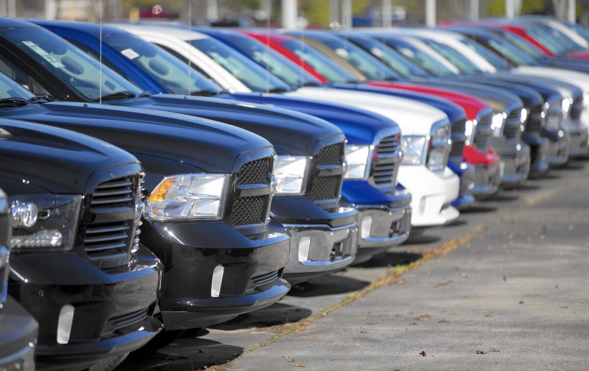 Dodge Ram pickup trucks are on display at a dealership in Morrow, Ga. December was one of the auto industry's best months of the year with sales of 1.5 million vehicles, 10.8% more than in the same month a year earlier.