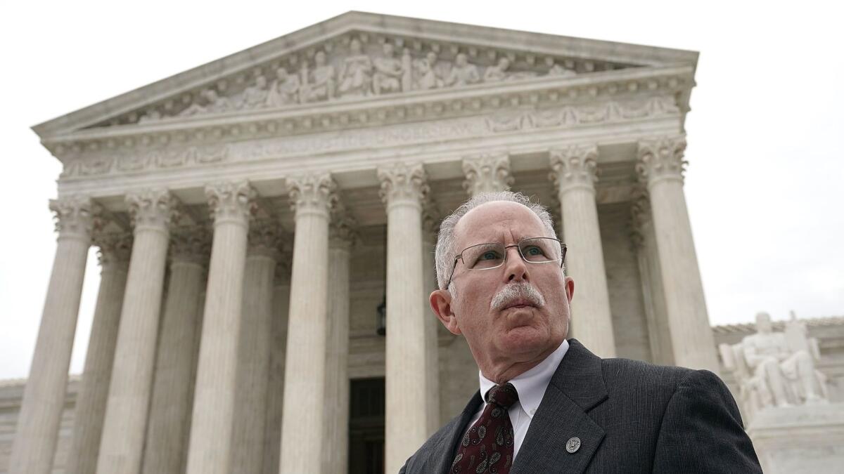 Plaintiff Mark Janus passes in front of the U.S. Supreme Court after a hearing in Washington on Feb. 26.
