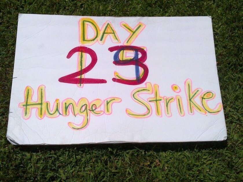 A protest placard on the lawn of the Capitol, where advocates of California inmates on hunger strike rallied to draw attention to the protest, now in its 44th day.