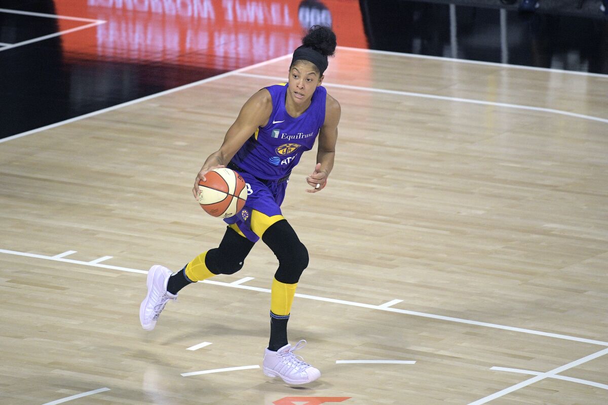 Candace Parker brings the ball up the court for the Sparks during a game on Aug. 15.