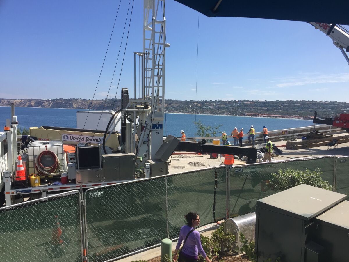 City subcontractors endeavor to stabilize the section of Coast Boulevard adjacent to the Brockton Villa Restaurant and La Jolla Bay Homes. The process will include filling Cook’s Crack with a slurry to prevent collapse of the roadway.