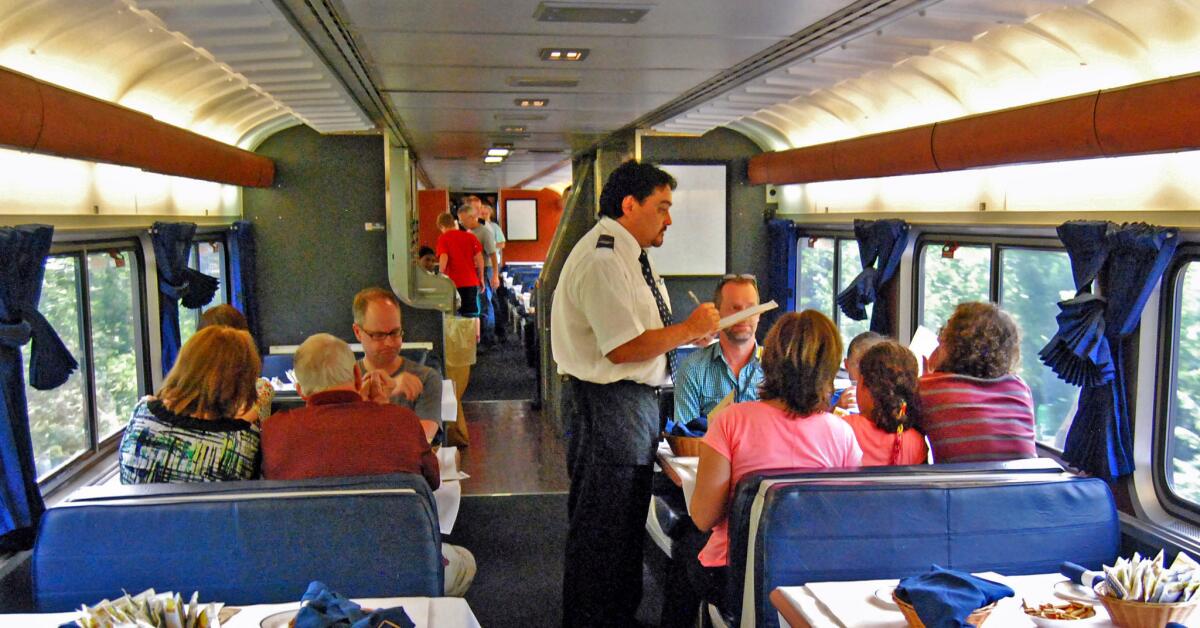 The lead service attendant takes dinner orders in the California Zephyr dining car.