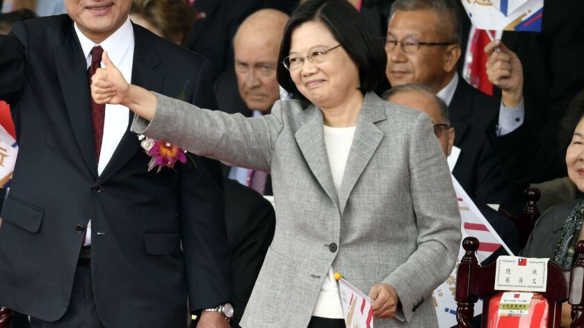 Taiwan's President Tsai Ing-wen gives a thumbs up during speech during National Day celebrations at the Presidential Palace in Taipei on Wednesday.