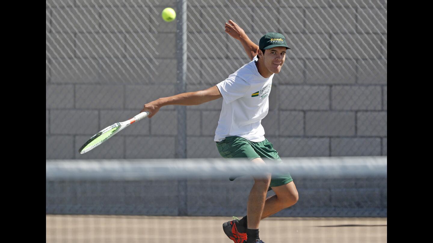 Edison High's Jason You follows through with a backhand against Walnut during a No. 1 singles set in the quarterfinals of the CIF Southern Section Division 2 playoffs at home on Monday.