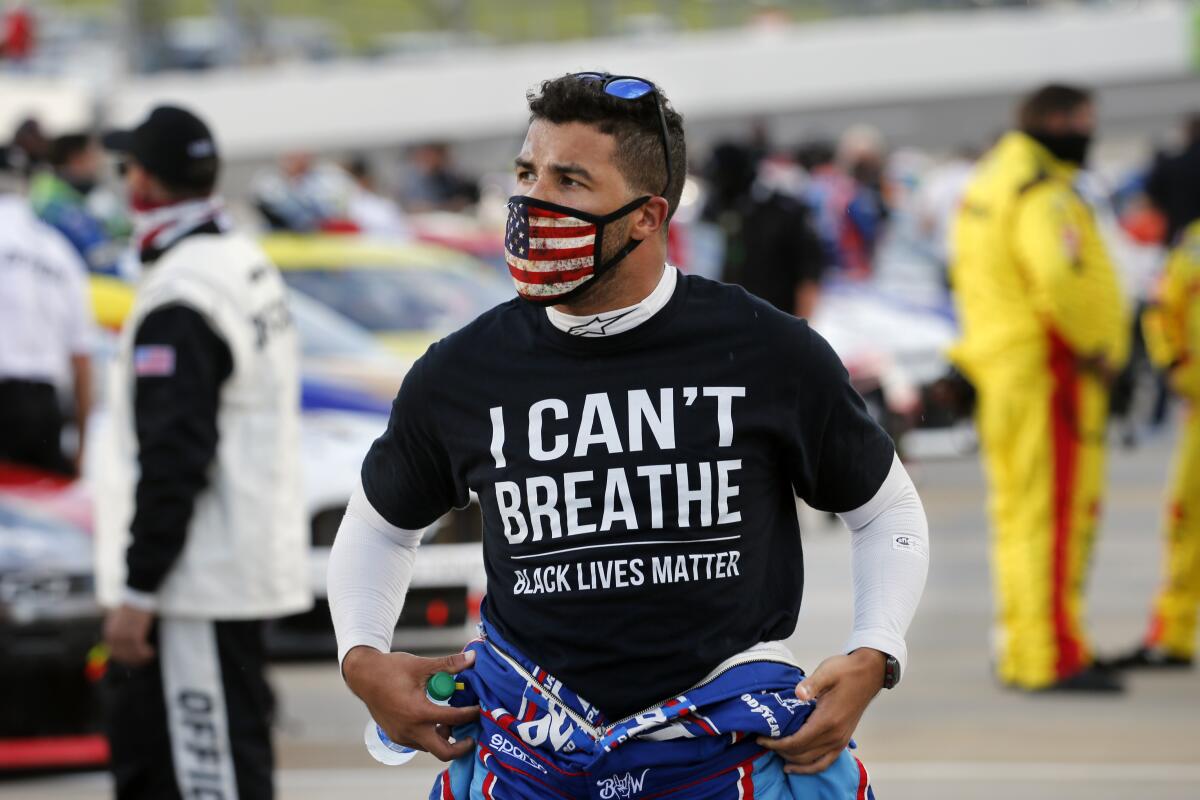NASCAR driver Bubba Wallace wears a Black Lives Matter shirt as he prepares for a race in Martinsville, Va.