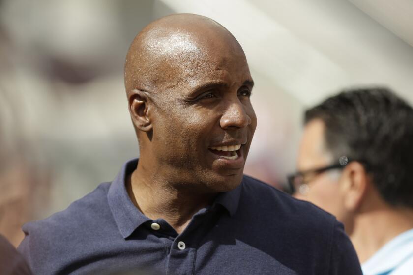 Former MLB slugger Barry Bonds is reportedly talking to the Miami Marlins about becoming a hitting coach on Don Mattingly's staff.