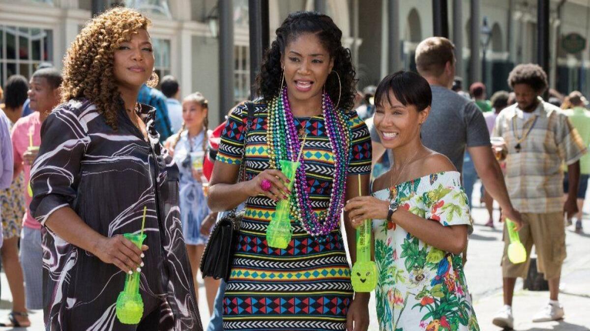 Tiffany Haddish is flanked by Queen Latifah, left, and Jada Pinkett Smith in "Girls Trip."