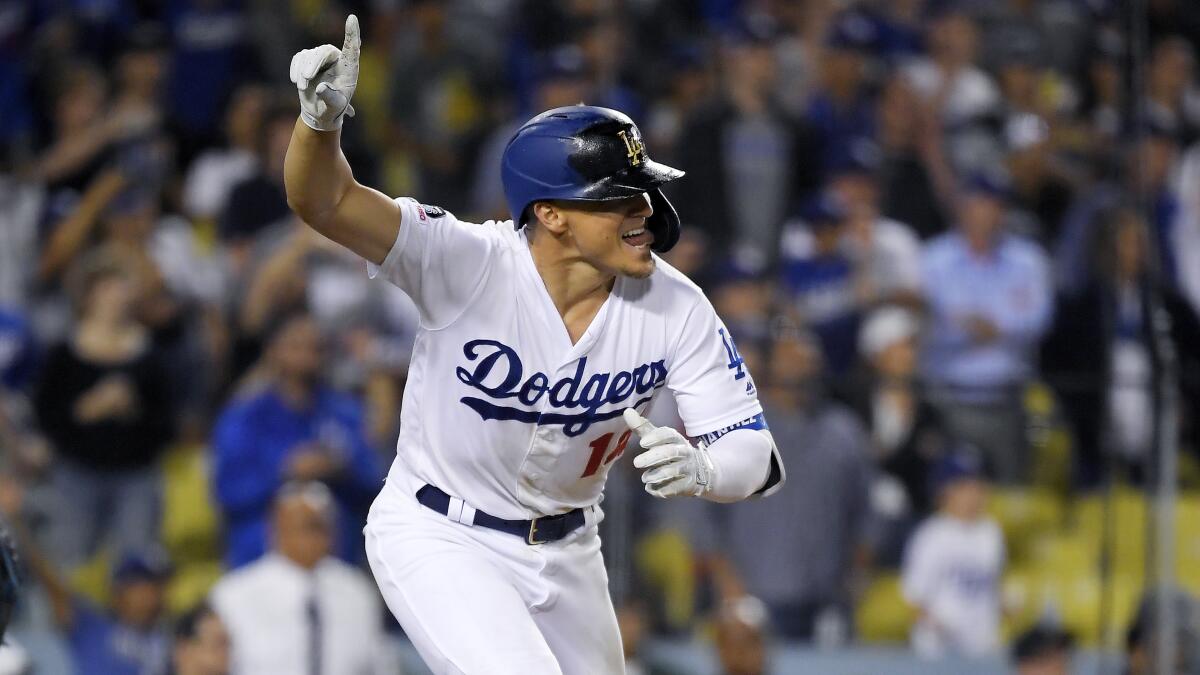 Dodgers' Enrique Hernandez gestures after hitting a walk-off single against the Toronto Blue Jays on Thursday.