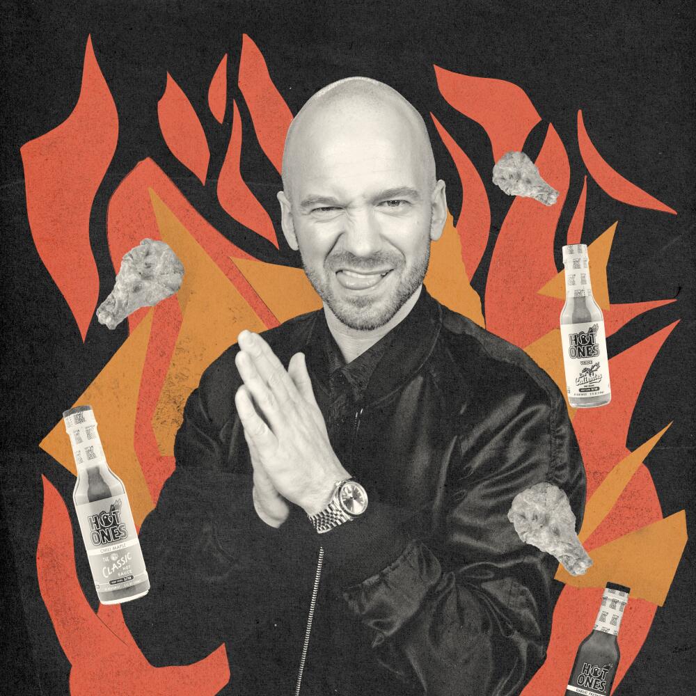 Portrait of Sean Evans in a stylized collage featuring hot sauce bottles, chicken wings and paper cut-out flames.