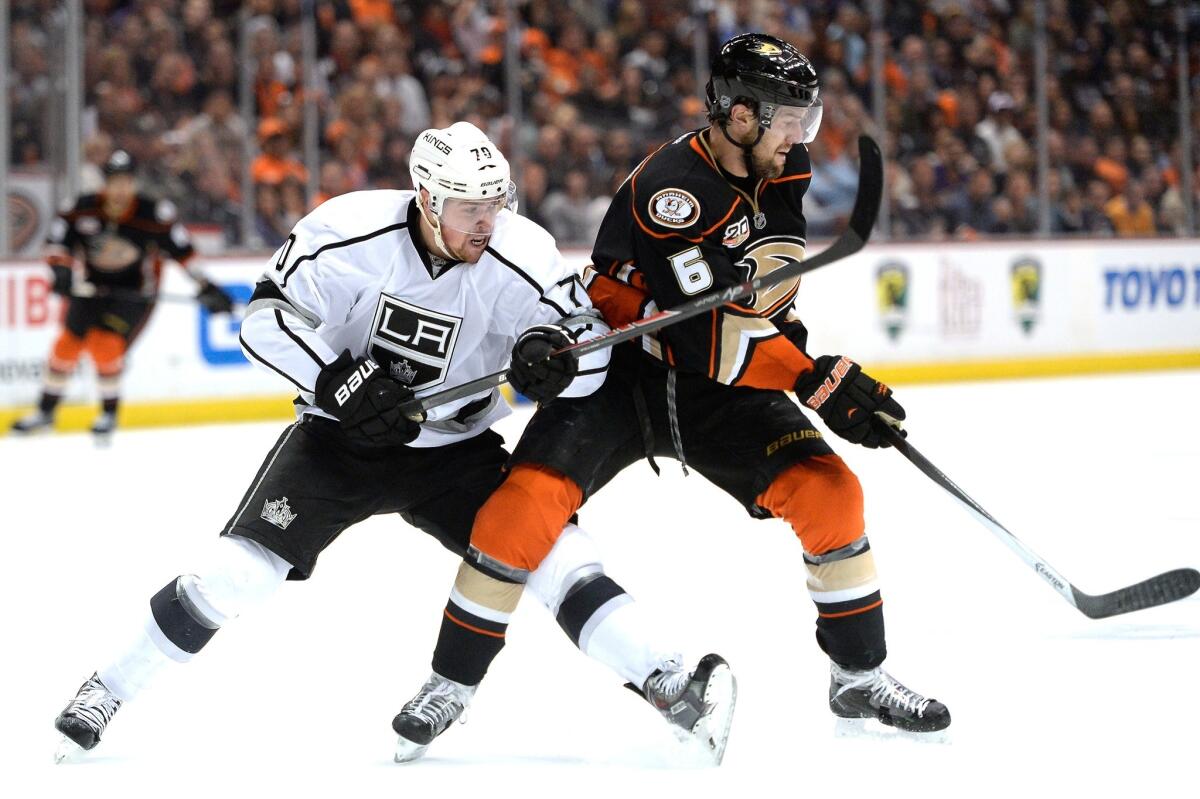 Ducks defenseman Ben Lovejoy (6) battles Kings forward Tanner Pearson for the puck in Game 2 on Tuesday night.