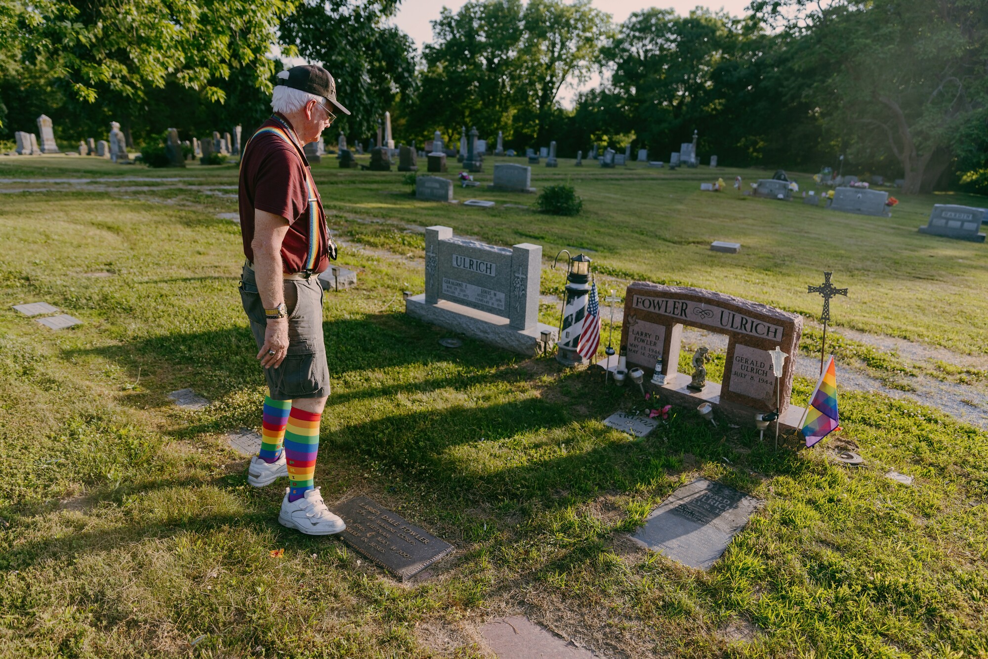 Gene Ulrich looks at his late husband Larry Fowler's gravesite.