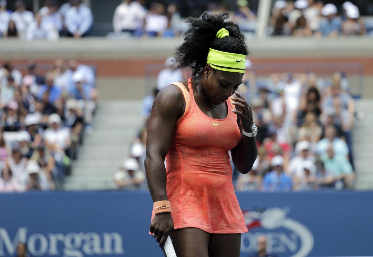 Serena Williams reacts after losing a point to Roberta Vinci during a semifinal match at the U.S. Open.