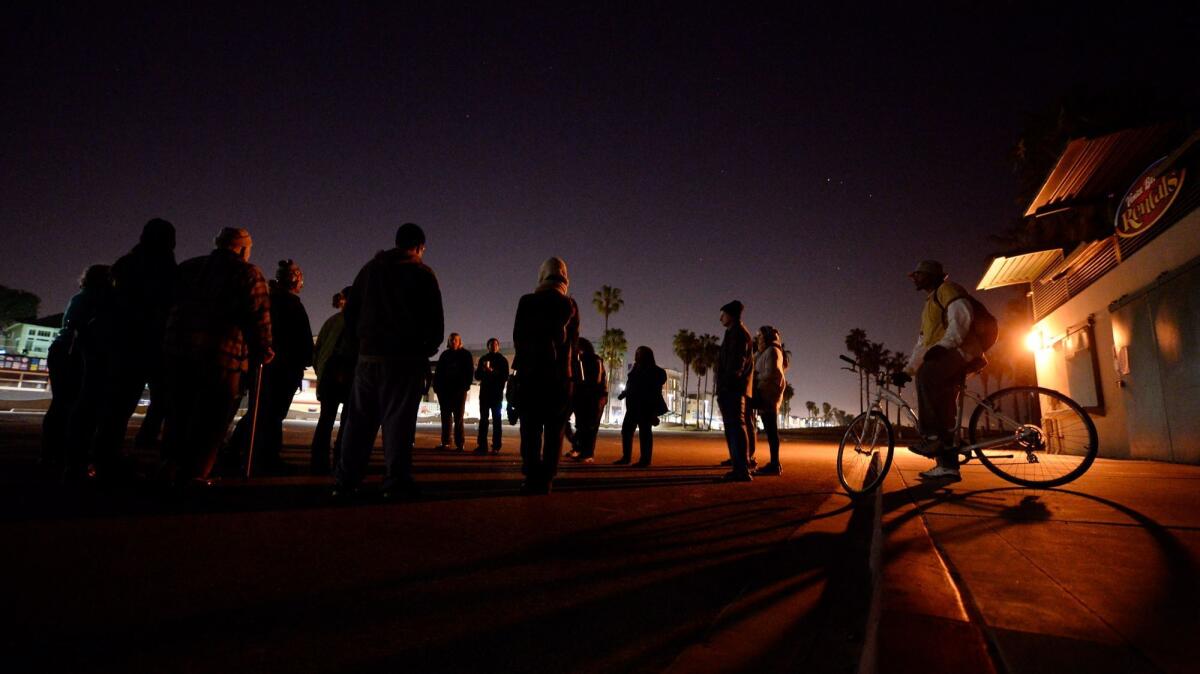 The city of Los Angeles has agreed to go before the Coastal Commission to defend its 30-year-old midnight curfew along 11 miles of shoreline. Above, the Venice boardwalk after dark.