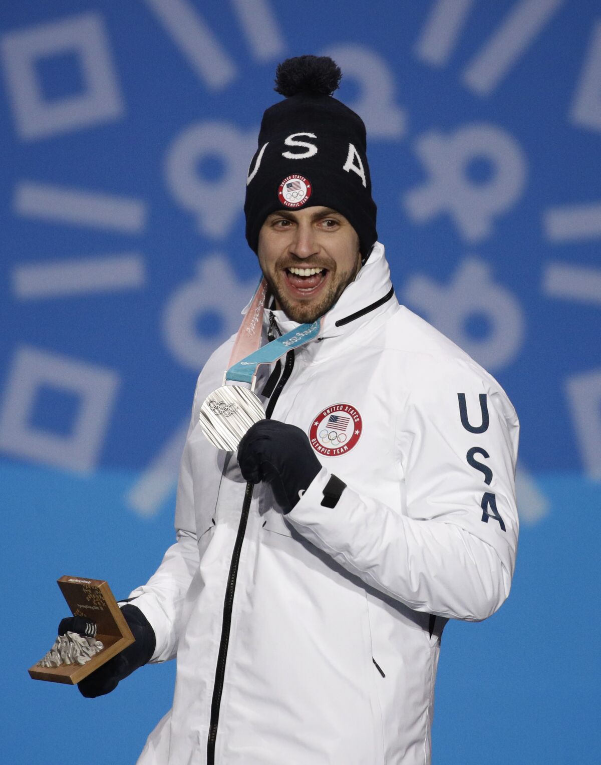 FILE - Men's luge competition silver medalist Chris Mazdzer, of the United States, smiles during the medals ceremony at the 2018 Winter Olympics in Pyeongchang, South Korea, Monday, Feb. 12, 2018. The men's luge, where Mazdzer is one of three Americans in the field, alongside Gustafson and Tucker West — starts Saturday, Feb. 5, 2022, with the first sliding medals of this year's Olympics to be awarded Sunday. (AP Photo/Jae C. Hong, File)