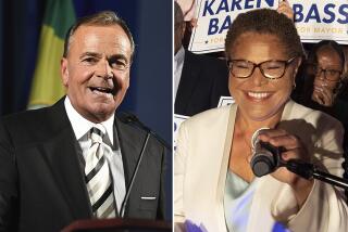 L.A. mayoral candidates Rick Caruso and Karen Bass on election night.