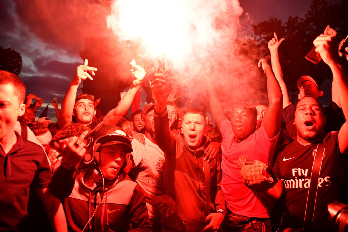 Fans celebrate on the Champs Elysees after France beat Belgium 1-0 to advance to the finals of the World Cup.
